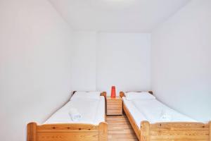 Postel nebo postele na pokoji v ubytování Gasthof Wastlwirt
