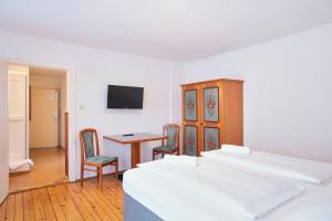 Postel nebo postele na pokoji v ubytování Gasthof Wastlwirt