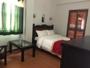 A bed or beds in a room at The Hotel
