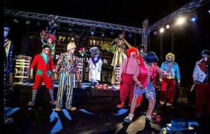 a group of people dressed in clown costumes on a stage at Seaview Chalets in Porto South Beach - Families only in Ain Sokhna