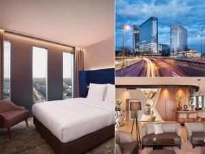 una camera con letto e vista sulla città di HYPERION Hotel München a Monaco