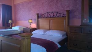Postel nebo postele na pokoji v ubytování Hotel BM International