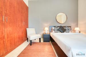 Katil atau katil-katil dalam bilik di Spotless Studio in Dubai Gate 2 JLT by Deluxe Holiday Homes