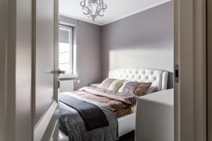 Posteľ alebo postele v izbe v ubytovaní ResiNest Apartamenty Nowe Bojary