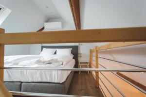 Postel nebo postele na pokoji v ubytování HDC Nivelles Grand-Place