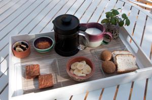 a tray of food with bread and other foods at Suite por los caminos del vino in Mendoza