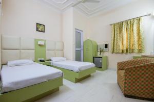 Postel nebo postele na pokoji v ubytování Hotel Kwality + 30 fotografií