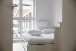 Posteľ alebo postele v izbe v ubytovaní Rozłogi Sunny Apartment
