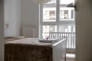 Posteľ alebo postele v izbe v ubytovaní Rozłogi Sunny Apartment