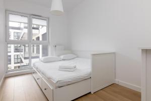 Posteľ alebo postele v izbe v ubytovaní Rozłogi Sunny Apartment
