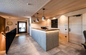 A kitchen or kitchenette at Aparthotel Panorama Living Dolomites