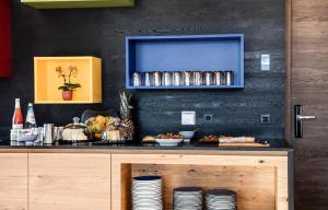 A kitchen or kitchenette at Aparthotel Panorama Living Dolomites
