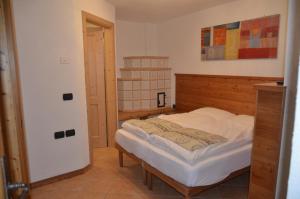 A bed or beds in a room at Residence Ca' Delle Margherite
