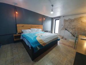 Cama o camas de una habitación en Hostalgia