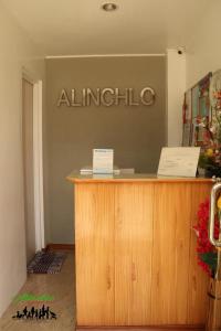 an entrance to an alitalia sign on a wall at Alinchlo Hotel in Legazpi