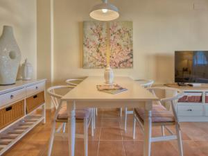 a dining room with a table and chairs at Holiday Home Campoverde by Interhome in Denia +25 photos