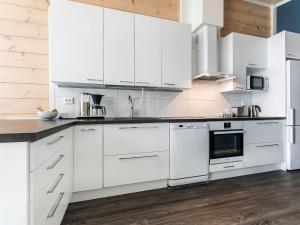 A kitchen or kitchenette at Holiday Home Metsola by Interhome