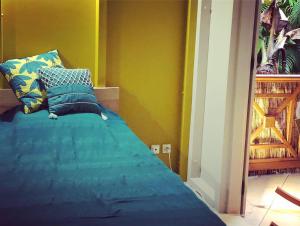 Ein Bett oder Betten in einem Zimmer der Unterkunft Ti coin paradis