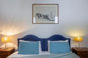 A bed or beds in a room at Ca degli Angeli