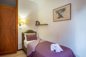 A bed or beds in a room at Ca degli Angeli