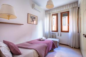 A bed or beds in a room at Ca degli Angeli