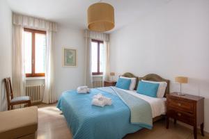 A bed or beds in a room at Ca degli Angeli