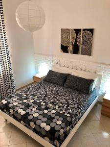 A bed or beds in a room at Casa Vacanze Kristel