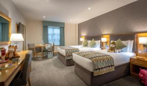 Krevet ili kreveti u jedinici u okviru objekta Westgrove Hotel