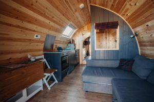 a small room with a bed and a kitchen at North Coast 500 Pods in Achmelvich