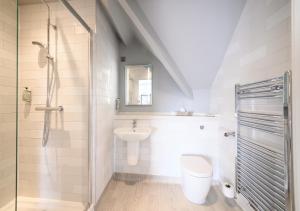 a bathroom with a shower and a toilet and a sink at Miller & Carter Aughton by Innkeeper's Collection in Ormskirk