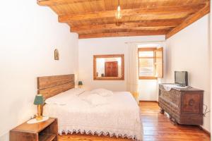 Tempat tidur dalam kamar di Casa Santa Croce