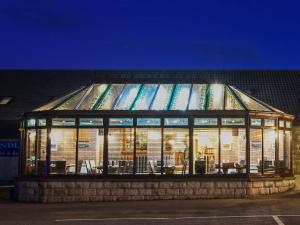 a glass building with a lot of windows at Findlay's in Fraserburgh