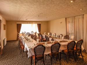 a conference room with a long table with chairs at Findlay's in Fraserburgh