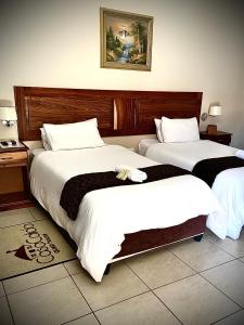 Ένα ή περισσότερα κρεβάτια σε δωμάτιο στο Casa Calida Guest House