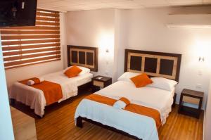 En eller flere senger på et rom på Torre Alba