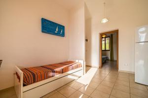 En eller flere senge i et værelse på Appartamento Bellavista a Fetovaia - Goelba