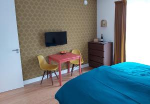 TV a/nebo společenská místnost v ubytování Luxury Suites Oosterwold