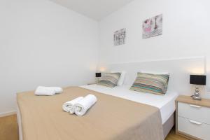 Postel nebo postele na pokoji v ubytování Royal Apartments