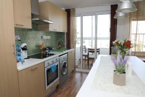 a kitchen with a sink and a stove top oven at Achillion Apartments By 'Flats Nicosia' in Nicosia