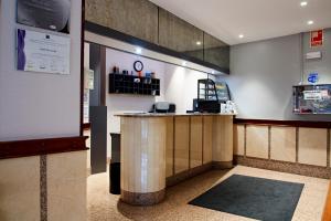 a bar in a restaurant with a counter at Hotel San Jorge in Santurce