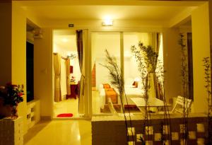 a living room with a door leading to a bedroom at Hai Yen Family Hotel in Mui Ne +114 photos