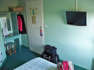 TV a/nebo společenská místnost v ubytování Fasthotel Lille Aéroport Lesquin