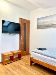 A bed or beds in a room at Pohoda Ubytovanie Stupava