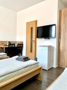 A bed or beds in a room at Pohoda Ubytovanie Stupava