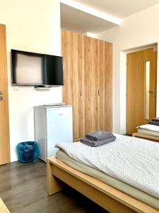 A bed or beds in a room at Pohoda Ubytovanie Stupava