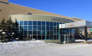 a building with a sign on the front of it at Dimond Center Hotel in Anchorage