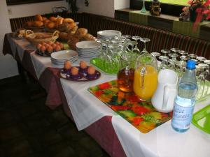 a table with a buffet of food and drinks at Hotel Tannenhof in Erlenbach am Main