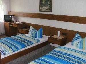 Postel nebo postele na pokoji v ubytování Hotel Tannenhof