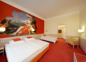 Säng eller sängar i ett rum på Hotel ADRIA München