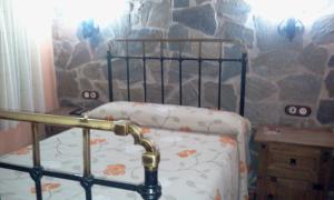 A bed or beds in a room at El Rincon Del Villar